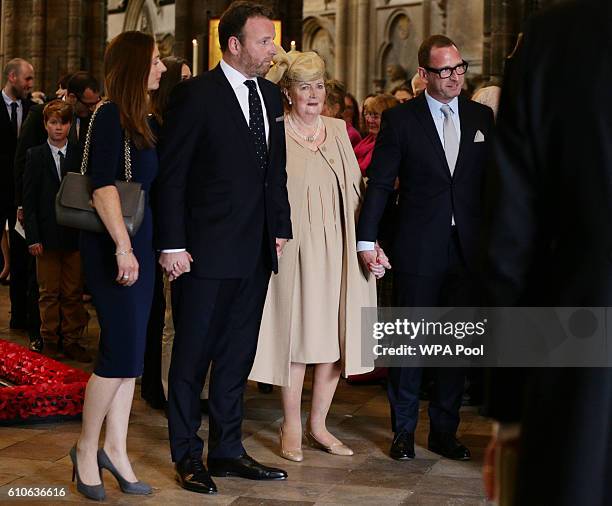 Lady Helen Wogan, the widow of Sir Terry Wogan, stands with their children, Katerine, Alan and Mark, as they leave Westminster Abbey, during a...