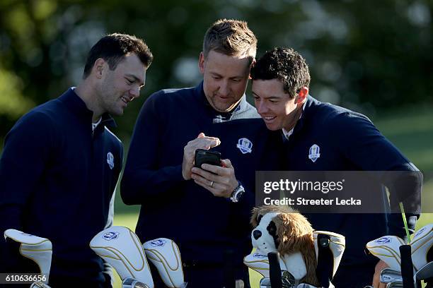 Martin Kaymer, vice-captain Ian Poulter and Rory McIlroy of Europe look on during team photocalls prior to the 2016 Ryder Cup at Hazeltine National...