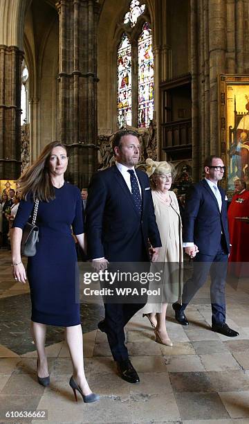 The family of Sir Terry Wogan, daughter Katerine, son Alan, his widow Helen and their son Mark , walk together as they leave Westminster Abbey,...