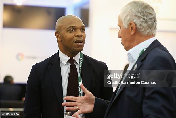 Former Manchester United footballer Quinton Fortune talks to former England goalkeeper Ray Clemence during day 2 of the Soccerex Global Convention...