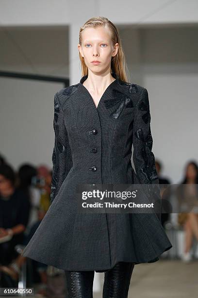 Model walks the runway during the Olivier Theysen show as part of the Paris Fashion Week Womenswear Spring/Summer 2017 on September 27, 2016 in...