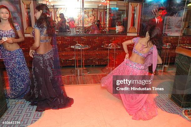 Bars and Restaurants - Bar Dancers - Bar girls entertain customers in a dance bar at Andheri West .