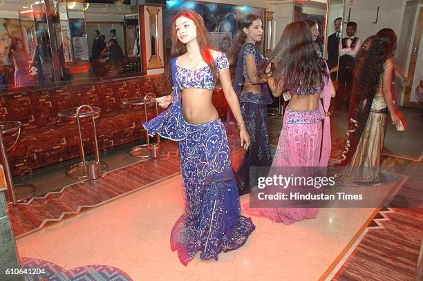 Bars and Restaurants - Bar Dancers - Bar girls entertain customers in a dance bar at Andheri West .