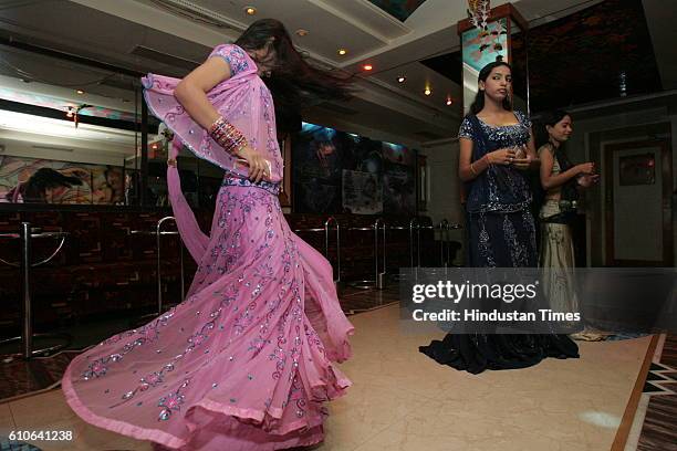 Bars and Restaurants - Bar Dancers - Bar girls entertain customers in a dance bar at Andheri West .