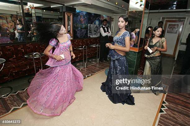 Bars and Restaurants - Bar Dancers - Bar girls entertain customers in a dance bar at Andheri West .