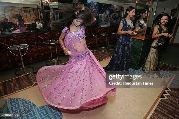 Bars and Restaurants - Bar Dancers - Bar girls entertain customers in a dance bar at Andheri West .