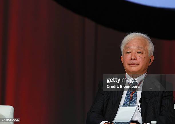 Naoki Okumura, president of the Japan Aerospace Exploration Agency , listens during a panel discussion at the 67th International Astronautical...