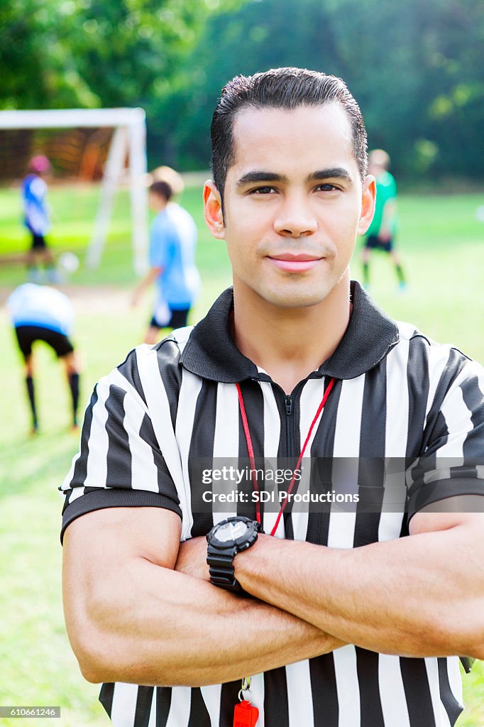 Handsome Hispanic referee before soccer game