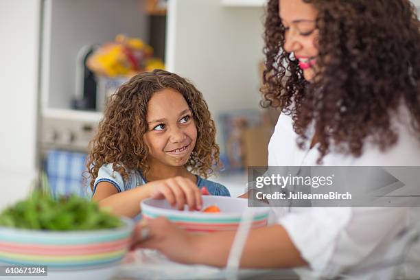 girl making funny face in kitchen - australian aboriginal children stock pictures, royalty-free photos & images