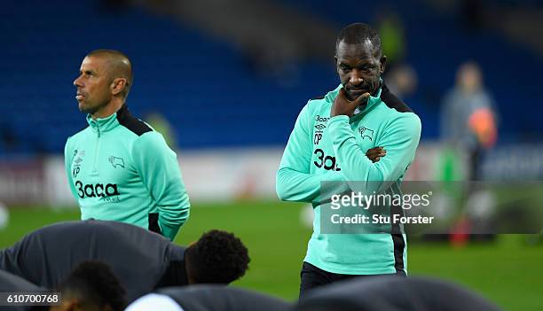 Derby coaches Kevin Phillips and Chris Powell look on before the Sky Bet Championship match between Cardiff City and Derby County at Cardiff City...