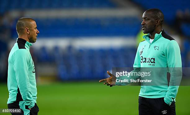 Derby coaches Kevin Phillips and Chris Powell look on before the Sky Bet Championship match between Cardiff City and Derby County at Cardiff City...