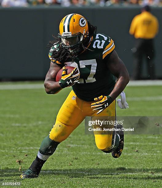 Eddie Lacy of the Green Bay Packers runs against the Detroit Lions at Lambeau Field on September 25, 2016 in Green Bay, Wisconsin. The Packers...