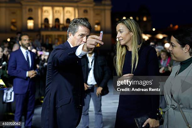 Hugh Grant and his girlfriend Anna Eberstein attend the 'Florence Foster Jenkins' Premiere and Golden Icon award ceremony during the 12th Zurich Film...