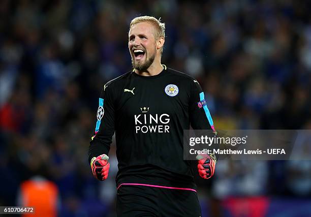 Kasper Schmeichel of Leicester City celebrates as Islam Slimani of Leicester City scores their first goal during the UEFA Champions League Group G...