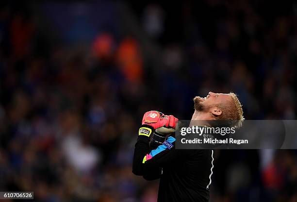 Kasper Schmeichel of Leicester City celebrates as Islam Slimani of Leicester City scores their first goal during the UEFA Champions League Group G...