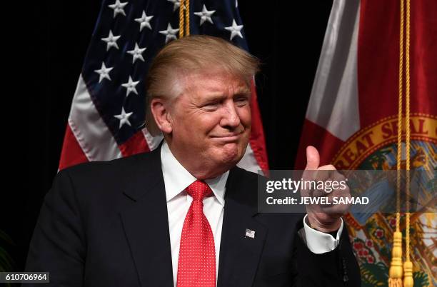 Republican presidential nominee Donald Trump leaves after speaking in a town hall meeting in Miami, Florida, on September 27, 2016.