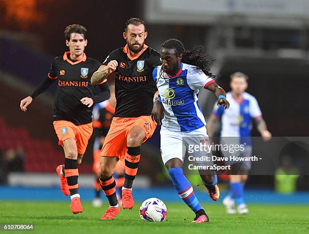 Blackburn Rovers' Marvin Emnes battles with Sheffield Wednesday's Steven Fletcher during the Sky Bet Championship match between Blackburn Rovers and...