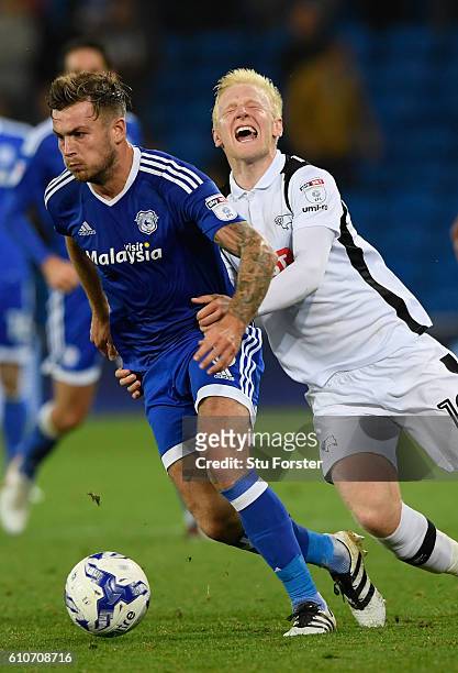 Derby player Will Hughes attempts to challenge Joe Ralls of Cardiff compete for a ball during the Sky Bet Championship match between Cardiff City and...