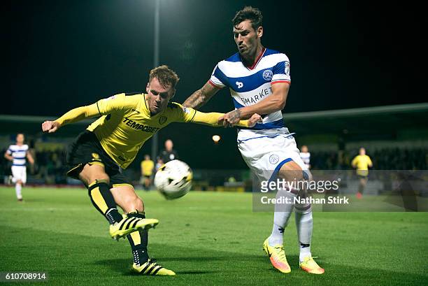 Tom Naylor of Burton Albion and Grant Hall of Queens Park Rangers in action during the Sky Bet Championship match between Burton Albion and Queens...