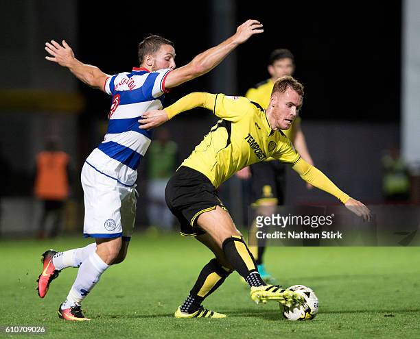 Tom Naylor of Burton Albion and Conor Washington of Queens Park Rangers in action during the Sky Bet Championship match between Burton Albion and...