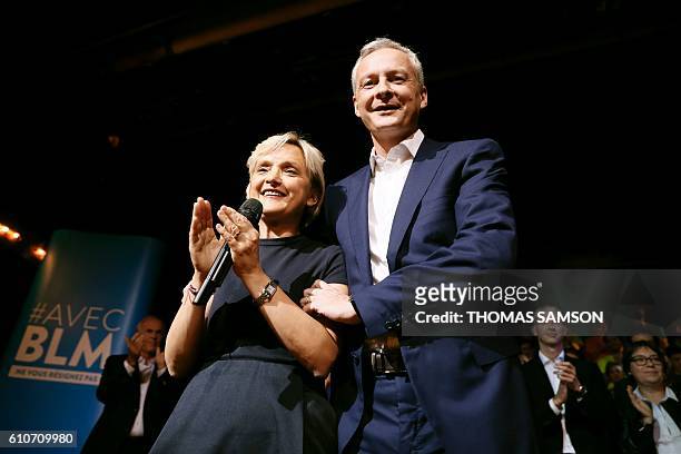 French right-wing Les Republicains candidate for the LR party primaries ahead of the 2017 presidential election, Bruno Le Maire stands next to Mayor...