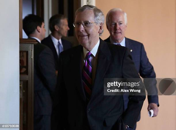 Senate Majority Leader Sen. Mitch McConnell , Senate Majority Whip Sen. John Cornyn and Sen. John Thune come out from the Senate Republican weekly...