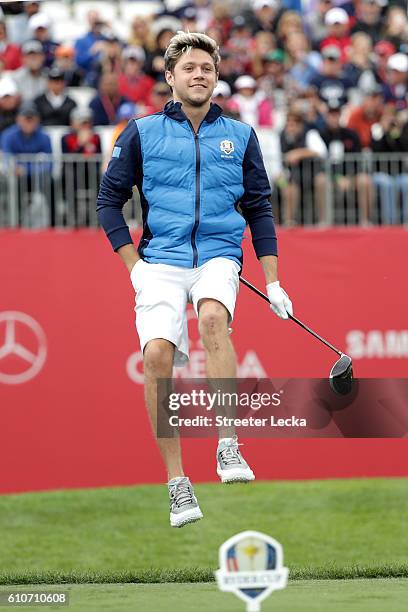 Singer Niall Horan of Europe prepares to hit off the first tee during the 2016 Ryder Cup Celebrity Matches at Hazeltine National Golf Club on...