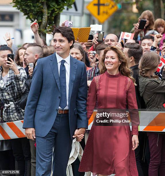 Prime Minister Justin Trudeau and his wife Sophie Gregoire-Trudeau arrive to the Immigrant Services Society, a charitable organisation that provides...