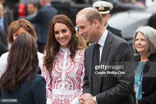 Catherine, Duchess of Cambridge and Prince William, Duke of Cambridge arrive to the Immigrant Services Society, a charitable organization that...