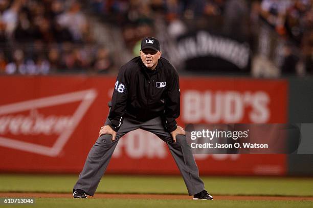 Umpire Ron Kulpa stands on the field during the second inning between the San Francisco Giants and the San Diego Padres at AT&T Park on September 13,...