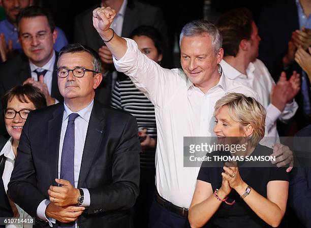 French right-wing Les Republicains candidate for the LR party primaries ahead of the 2017 presidential election, Bruno Le Maire , next to member of...