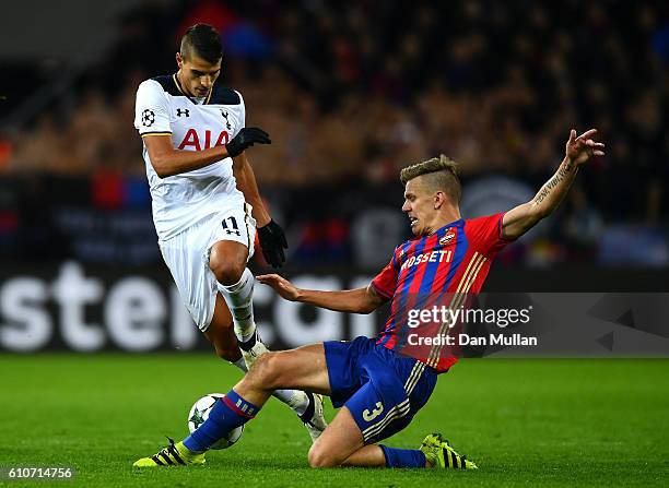 Pontus Wernbloom of CSKA Moscow tackles Erik Lamela of Tottenham Hotspur during the UEFA Champions League Group E match between PFC CSKA Moskva and...