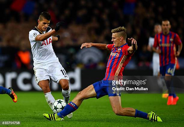 Pontus Wernbloom of CSKA Moscow tackles Erik Lamela of Tottenham Hotspur during the UEFA Champions League Group E match between PFC CSKA Moskva and...