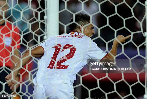 Sevilla's French forward Wissam Ben Yedder celebrates after scoring a goal during the UEFA Champions League Group H football match Sevilla FC vs...