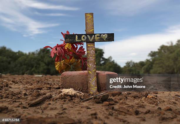 Marker stands over an immigrant's grave on September 27, 2016 in Holtville, California. Hundreds of immigrants, many who died while crossing the...
