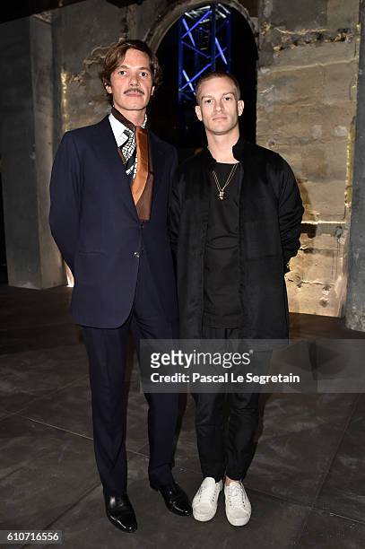 Elie Top and a guest attend the Saint Laurent show as part of the Paris Fashion Week Womenswear Spring/Summer 2017 on September 27, 2016 in Paris,...