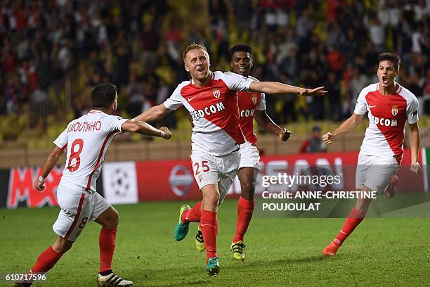 Monaco's Polish defender Kamil Glik celebrates after scoring a goal during the UEFA Champions League football match AS Monaco vs Bayer Leverkusen, on...