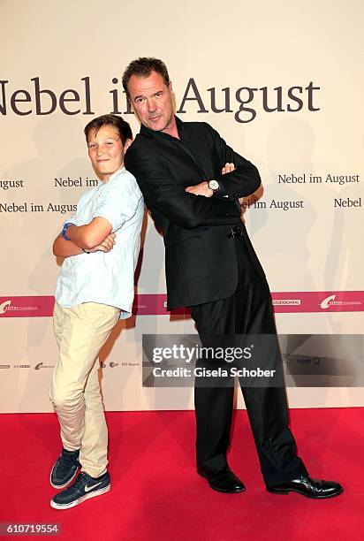 Ivo Pietzcker and Sebastian Koch during the premiere of the film 'Nebel im August' at City Kino on September 27, 2016 in Munich, Germany.