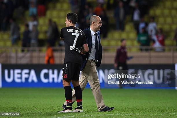 Monaco FC head coach Leonardo Jardim consoles Javier Hernandez of Bayer 04 Leverkusen at the end of the UEFA Champions League Group E match between...