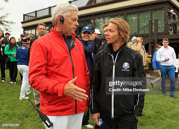 United States Team Captain Jim Remy talks with Europe team captain Maitena Alsuguren following the Junior Ryder Cup at Interlachen Country Club on...