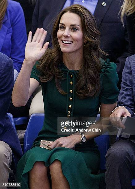 Catherine, Duchess of Cambridge waves to the crowd during a volleyball match at University of British Columbia Okanagan on September 27, 2016 in...