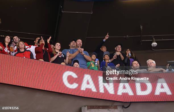 Fans cheer on Team Canada after scoring a first period goal on Team Europe during Game One of the World Cup of Hockey final series at the Air Canada...