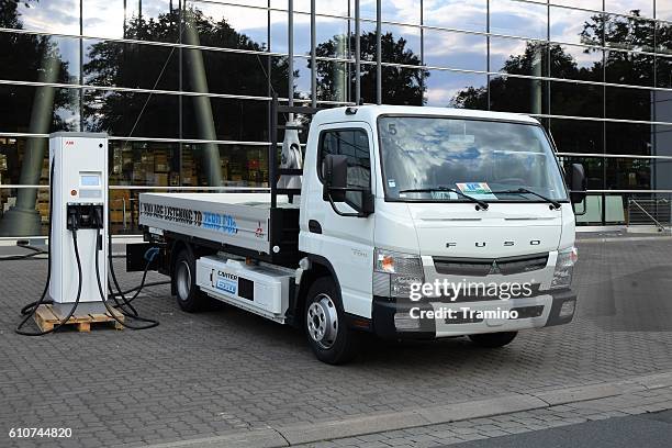 fuso canter e-cell on the charging station - tesla truck stock pictures, royalty-free photos & images