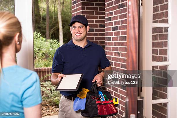 repairman at customer's front door. - happy electrician stock pictures, royalty-free photos & images