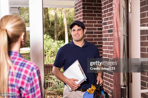 repairman at customer's front door. - tradesman toolkit stock pictures, royalty-free photos & images