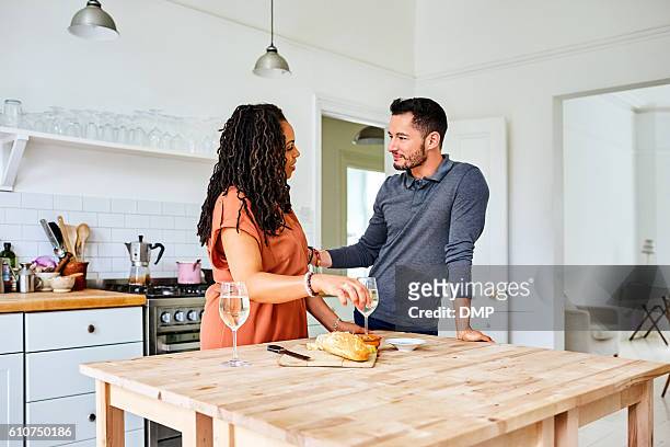 Transgender male with his wife at breakfast table in kitchen