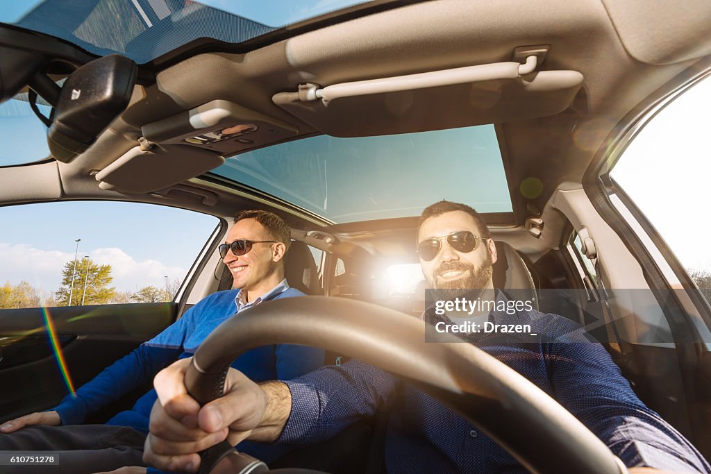 Wide angle image of two adults in car