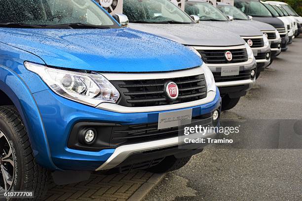 modern pick-up vehicles in a row - fiat stock pictures, royalty-free photos & images