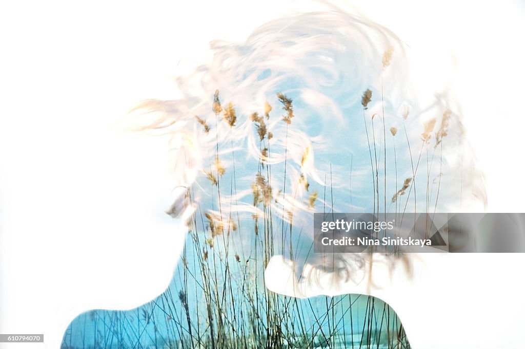 Nature view and woman's body - double exposure image