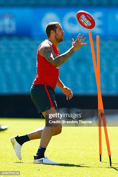 Lance Franklin of the Swans handles a ball during a Sydney Swans AFL media session at Sydney Cricket Ground on September 28, 2016 in Sydney,...